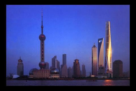 Shanghai Tower and city skyline at night
